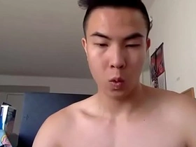 Solo Asian cam star masturbates on camera